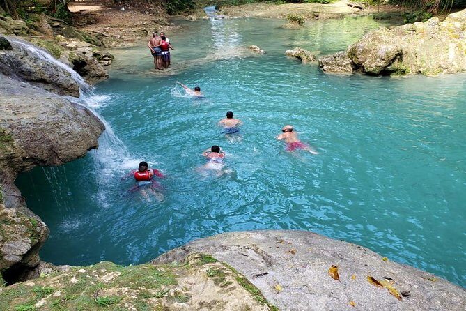 Blue Hole & Secret Falls Day-Trip with Shopping from Grand Palladium - Cool Blue Hole: swimming, jumps, and rope swings in one natural pool area