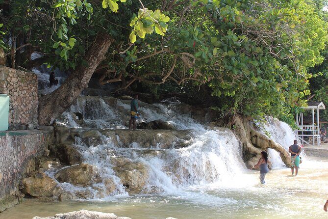 Dunn's River Park & Blue Hole Waterfall Combo from Montego Bay - Dunn’s River Falls & Park: climb the 960-foot cascade, then cool down on the beach