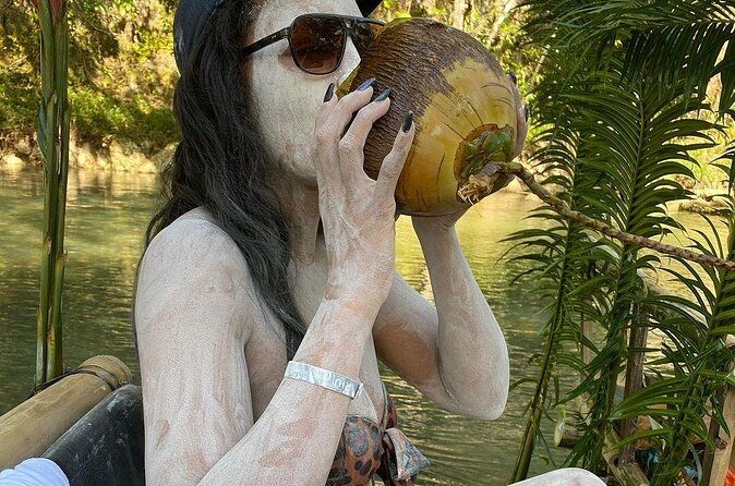 Great River Bamboo Rafting and Limestone Full Body Massage Tour From Montego Bay - Coconut drink, swimming options, and the vendor reality