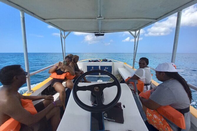 Negril Glass Bottom Boat Tour Snorkeling and Booby Cay - The ride out: 15 minutes of glass-bottom spotting