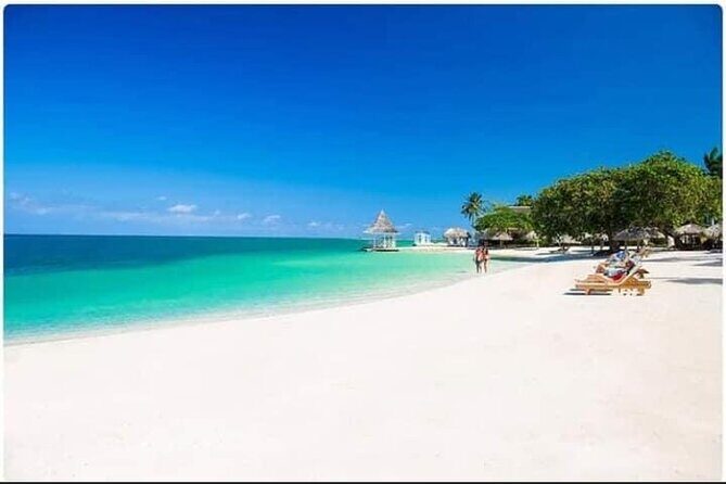 Negril Seven Miles Beach, Snorkeling, Boat Ride, Ricks Cafe Combo - Margaritaville Stop: Beach Energy, Shopping, and Snacks