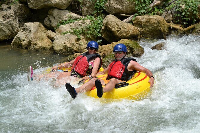 River Rapids Waterfalls Tubing and Beach Adventure with Transport - Tubing the Rio Bueno: Calm Current, Then Small Rapids